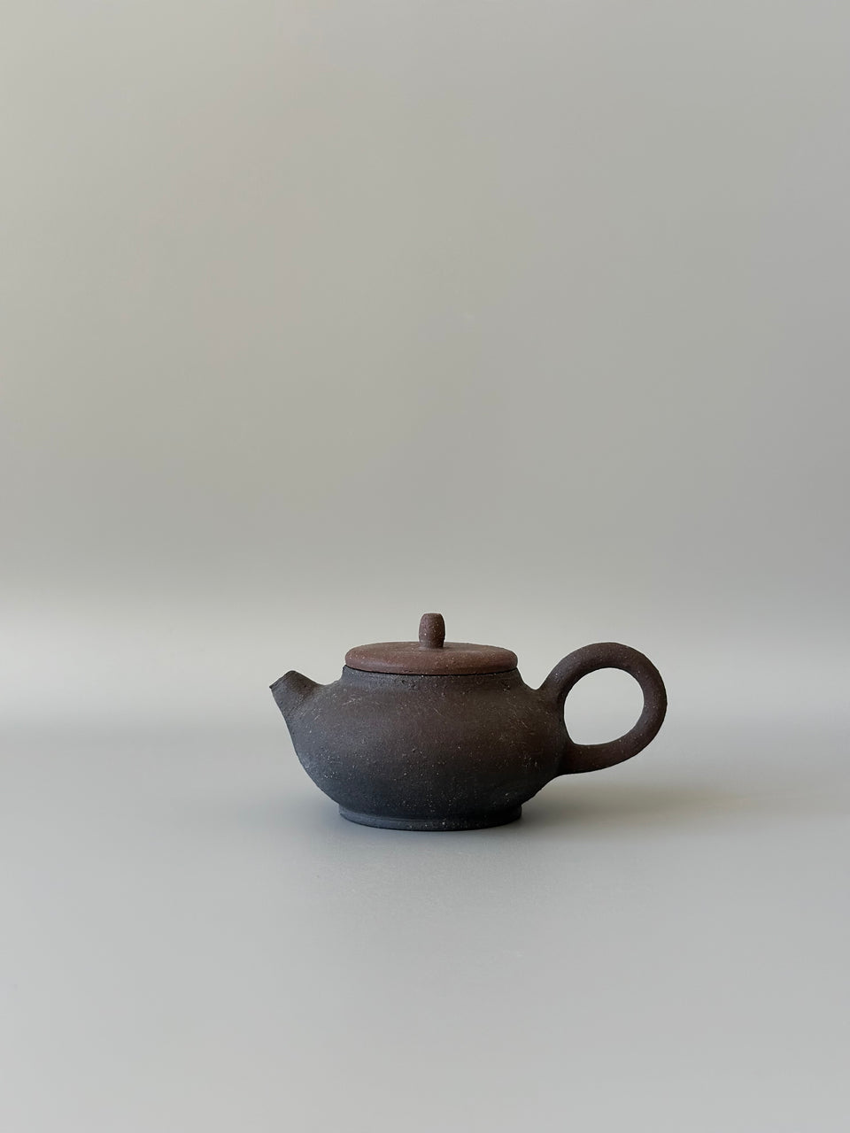 Brown and black earthy teapot