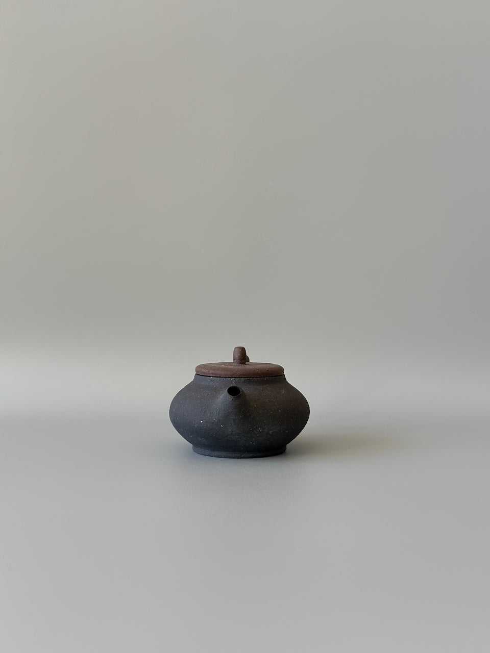 Brown and black earthy teapot