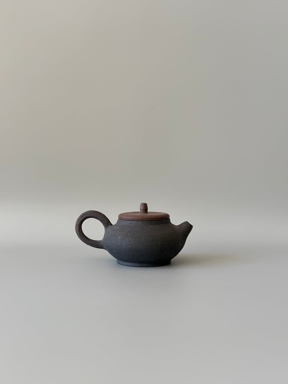 Brown and black earthy teapot