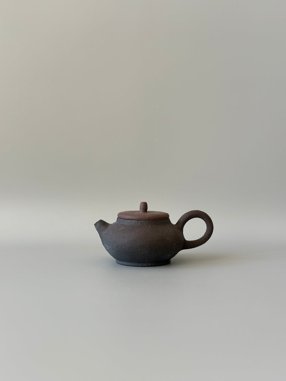 Brown and black earthy teapot